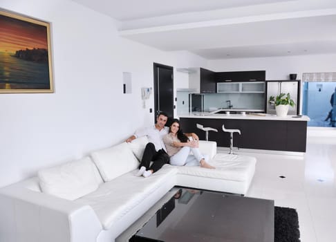 happy young couple relax at modern home living room indoor