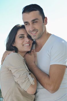 happy young couple in love have romance  relax on balcony outdoor with ocean and blue sky in background