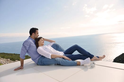 romantic happy young couple relax at modern home outdoors