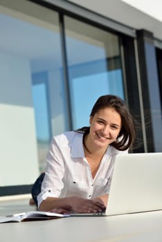 beautiful young woman relax and work on laptop computer modern  home office