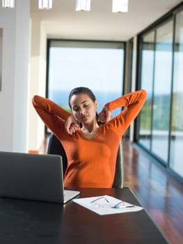 beautiful young woman relax and work on laptop computer modern  home office