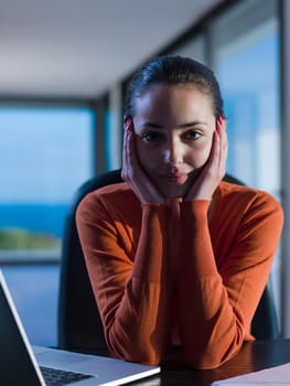 beautiful young woman relax and work on laptop computer modern  home office