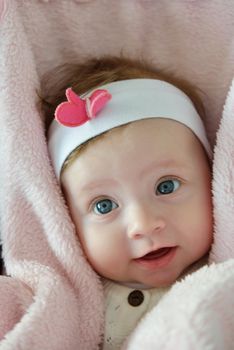 cute happy baby with blue eyes and white and clean face