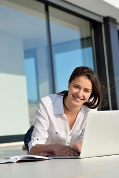 beautiful young woman relax and work on laptop computer modern  home office