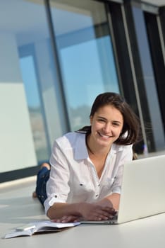 beautiful young woman relax and work on laptop computer modern  home office