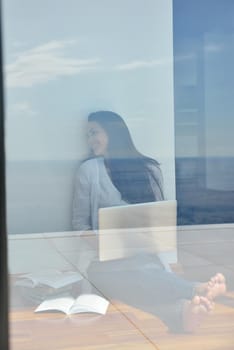 beautiful young woman relax and work on laptop computer modern  home office