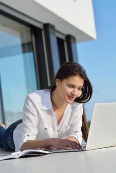 beautiful young woman relax and work on laptop computer modern  home office