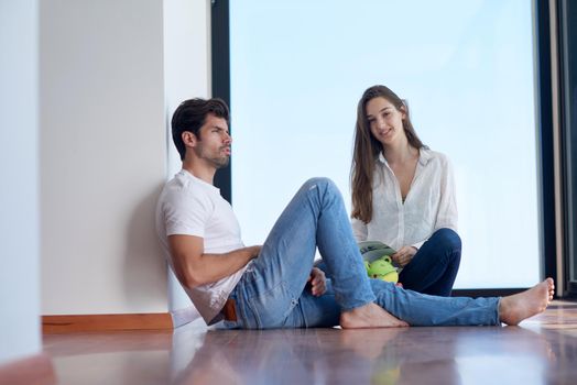 romantic happy young couple relax at modern home staircase indoors