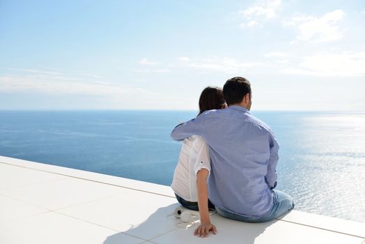 romantic happy young couple relax at modern home outdoors