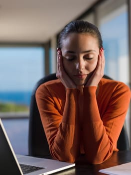 beautiful young woman relax and work on laptop computer modern  home office