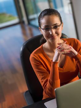 beautiful young woman relax and work on laptop computer modern  home office