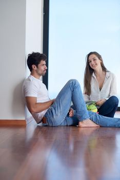 romantic happy young couple relax at modern home staircase indoors