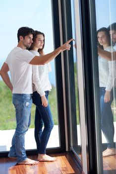 romantic happy young couple relax at modern home staircase indoors