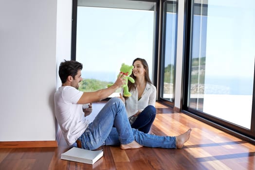 romantic happy young couple relax at modern home staircase indoors