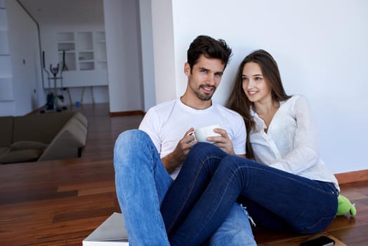 romantic happy young couple relax at modern home staircase indoors