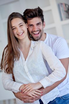 happy young romantic couple have fun relax smile at modern home outdoor terace balcony terace