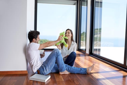 romantic happy young couple relax at modern home staircase indoors