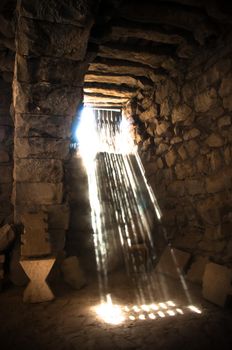 sun rays beaming through the jail window into the cell