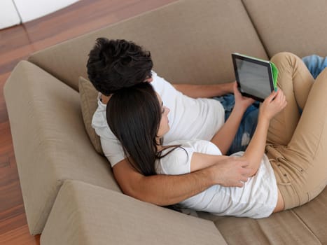 cheerful happy young couple making selfie together at home