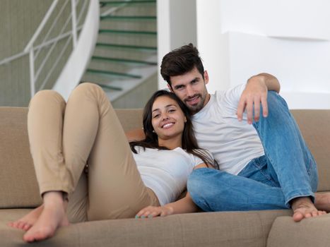 cheerful happy young couple making selfie together at home