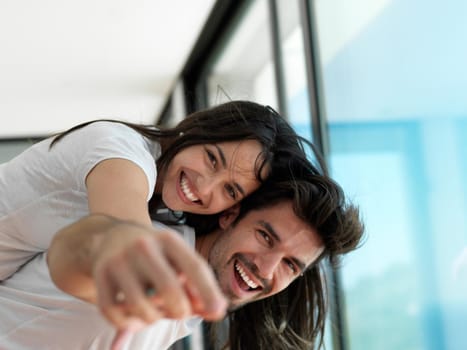 romantic happy young couple relax at modern home indoors and have fun