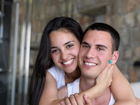 happy young couple relax and have fun in bed