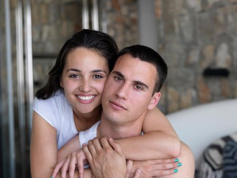 happy young couple relax and have fun in bed