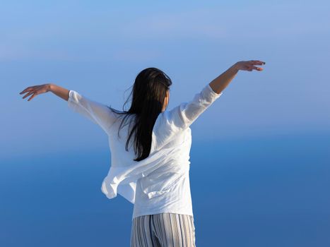 happy young woman enjoy sunset while dancing and enjoy music on headphones