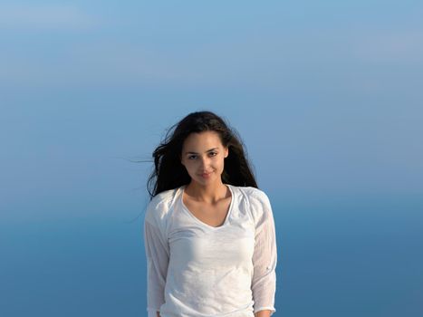 happy young woman enjoy sunset while dancing and enjoy music on headphones