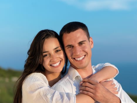 happy young romantic couple have fun relax smile at modern home outdoor terace balcony terace