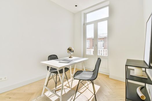 A cozy and spacious office room in a luxury design