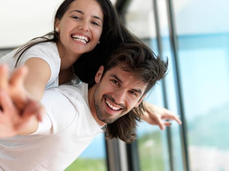 romantic happy young couple relax at modern home indoors and have fun