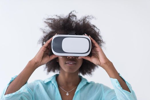 Happy african american girl getting experience using VR headset glasses of virtual reality, isolated on white background