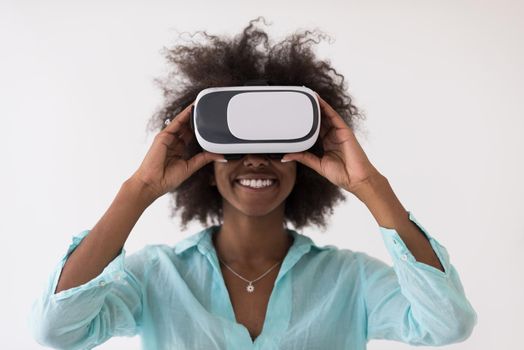 Happy african american girl getting experience using VR headset glasses of virtual reality, isolated on white background