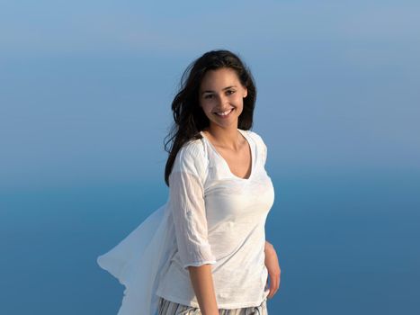 happy young woman enjoy sunset while dancing and enjoy music on headphones