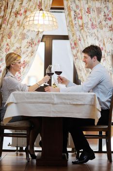 A young couple having romantic  dinner at a restaurant