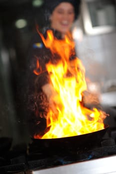 beautiful young chef woman prepare and decorating tasty food in kitchen