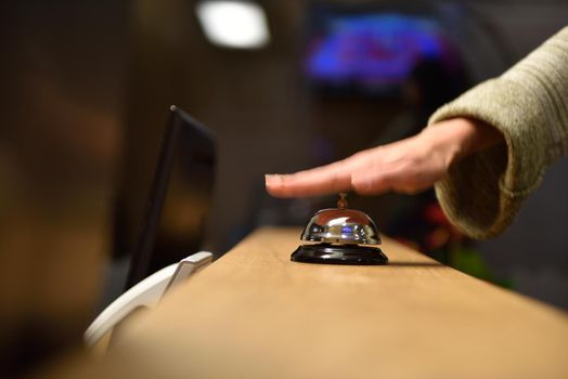 business woman at the reception of a hotel checking in