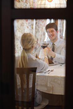 A young couple having romantic  dinner at a restaurant