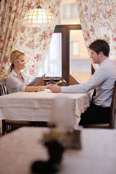 A young couple having dinner at a restaurant