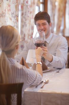 A young couple having dinner at a restaurant