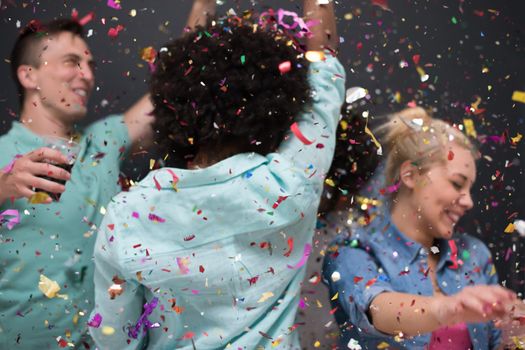 confetti party Multiethnics group of happy young people celebrating new year eve while dancing and have fun at home