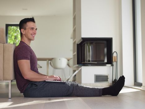 Real man Using laptop on the floor At Home  Enjoying Relaxing