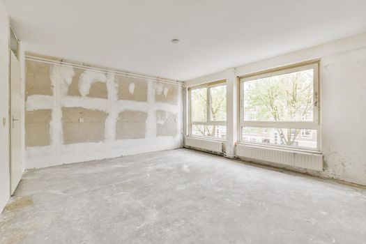 Interior design of a bright room with large windows