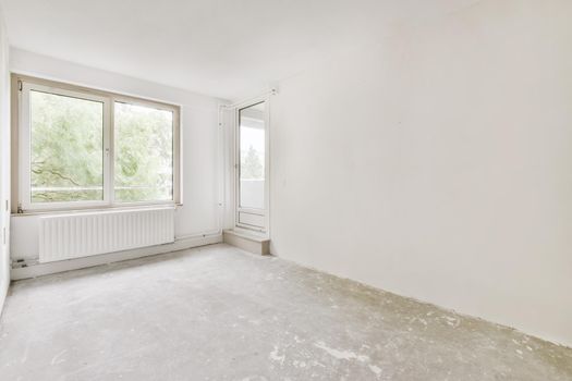 Interior design of a bright room with large windows