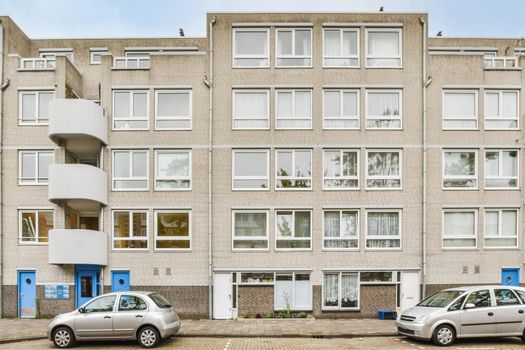 Beautiful view of a residential building with parking