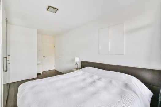 Spacious bedroom with a soft double bed and wardrobe