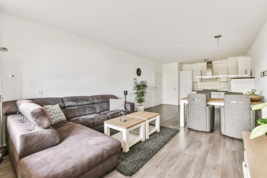 Large modern studio room with living room, dining area and kitchen