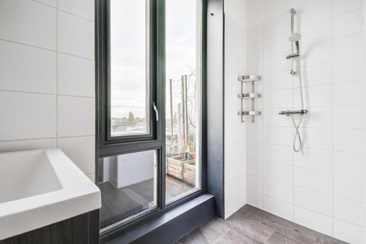 Modern shower stall in a bright bathroom