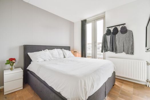 Stylish interior of contemporary room with comfortable bed